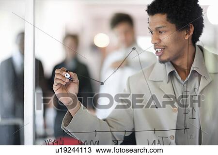 Businessman drawing graph on window View Large Photo Image Stock Image - Businessman drawing graph on window. Fotosearch