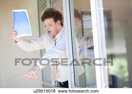 Stock Photo - Businessman shouting from office window. Fotosearch