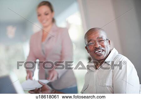 Businessman talking in meeting View Large Photo Image Stock Image - Businessman talking in meeting. Fotosearch