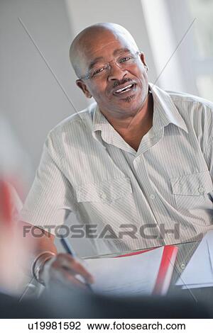 Businessman talking in meeting View Large Photo Image Stock Image - Businessman talking in meeting. Fotosearch