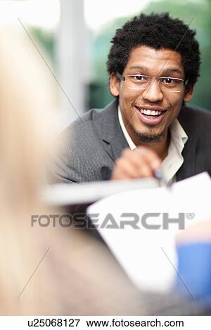 Businessman talking in meeting View Large Photo Image Stock Photo - Businessman talking in meeting. Fotosearch