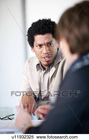 Businessman talking in meeting View Large Photo Image Stock Photography - Businessman talking in meeting. Fotosearch