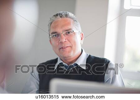 Stock Photography - Businessman talking in meeting. Fotosearch