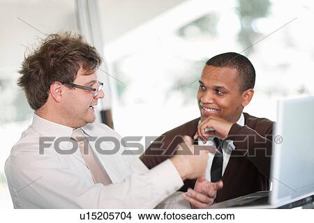 Businessmen talking in meeting View Large Photo Image Picture - Businessmen talking in meeting. Fotosearch