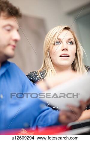 Picture - Businesswoman talking in meeting. Fotosearch