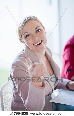 Stock Photo - Businesswoman talking in meeting. Fotosearch