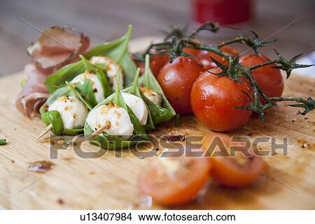 Cheese with herbs and tomato View Large Photo Image Picture - Cheese with herbs and tomato. Fotosearch
