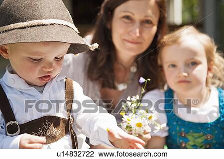 Stock Image - Children in traditional Bavarian clothes. Fotosearch