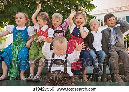 Stock Image - Children in traditional Bavarian clothes. Fotosearch