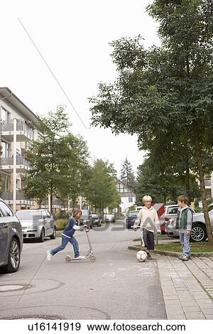 Children playing on suburban street View Large Photo Image Stock Photo - Children playing on suburban street. Fotosearch