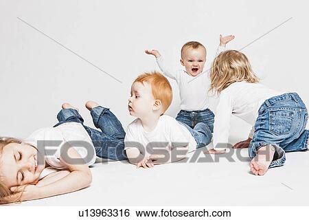 Children playing together View Large Photo Image Stock Photograph - Children playing together . Fotosearch