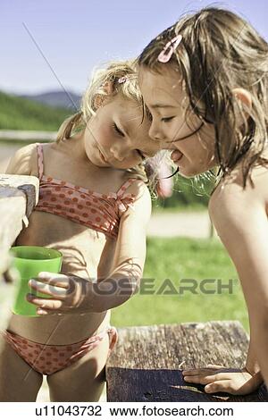 Children playing with water in backyard View Large Photo Image Stock Image - Children playing with water in backyard. Fotosearch