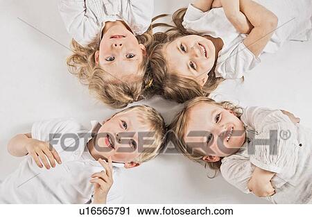 Stock Image - Children posing together . Fotosearch