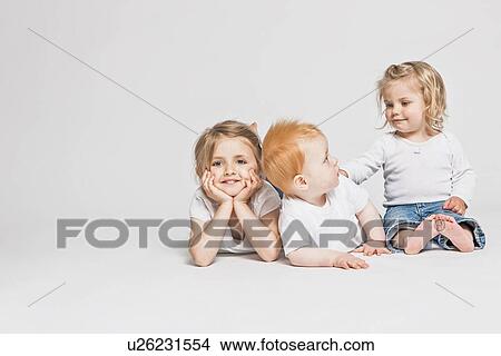 Picture - Children sitting together . Fotosearch