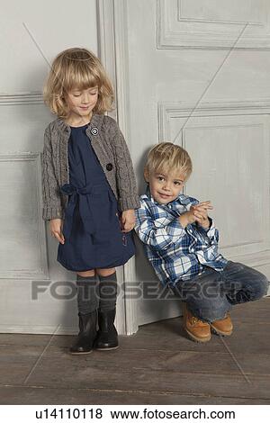 Stock Photo - Children smiling together indoors. Fotosearch