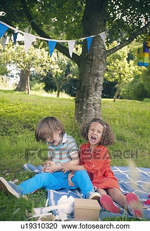 Children yelling at birthday picnic Stock Image | u19310320 | Fotosearch