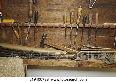 Stock Photo - Chisels and wood on workbench. Fotosearch