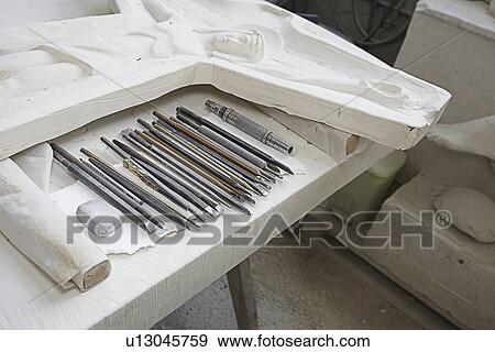Chisels by stone relief carving View Large Photo Image Stock Photo - Chisels by stone relief carving. Fotosearch
