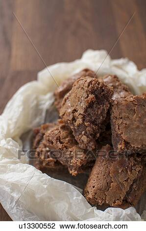 Chocolate brownies in wax paper View Large Photo Image Stock Image - Chocolate brownies in wax paper. Fotosearch