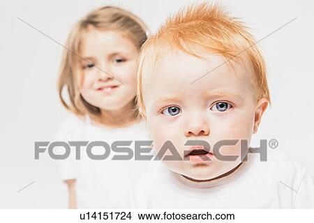Picture - Close up of babys curious face. Fotosearch