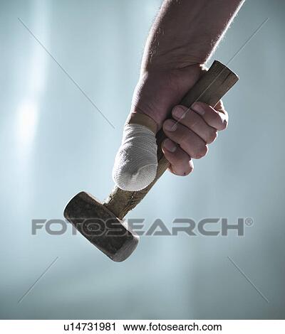 Close up of bandaged thumb and mallet View Large Photo Image Stock Image - Close up of bandaged thumb and mallet. Fotosearch