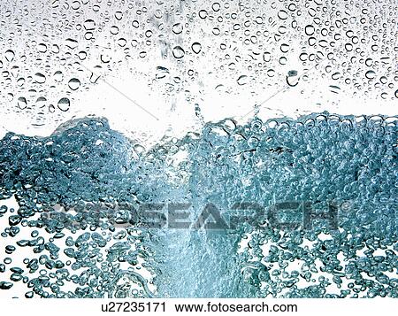Stock Image - Close up of bubbles in water. Fotosearch