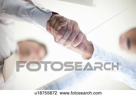 Close up of businessmen shaking hands View Large Photo Image Stock Image - Close up of businessmen shaking hands. Fotosearch