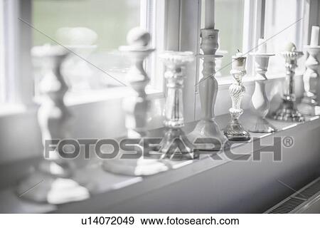 Close up of candlesticks on windowsill View Large Photo Image Stock Photo - Close up of candlesticks on windowsill. Fotosearch