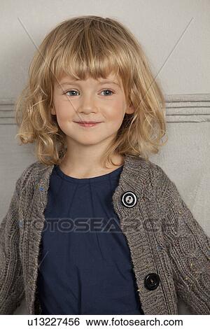 Stock Photograph - Close up of girls smiling face. Fotosearch
