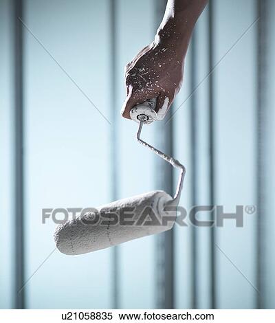 Close up of hand holding paint roller View Large Photo Image Stock Photography - Close up of hand holding paint roller. Fotosearch