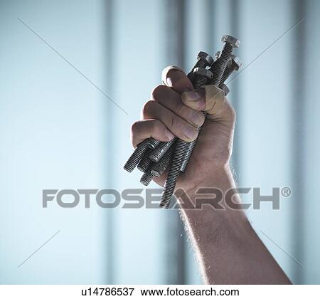 Close up of hand holding screws View Large Photo Image Stock Photo - Close up of hand holding screws. Fotosearch