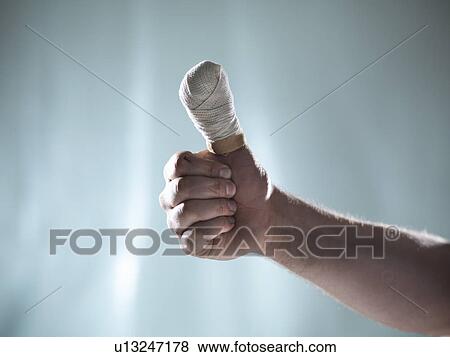 Close up of hand with bandaged thumb View Large Photo Image Stock Photo - Close up of hand with bandaged thumb. Fotosearch