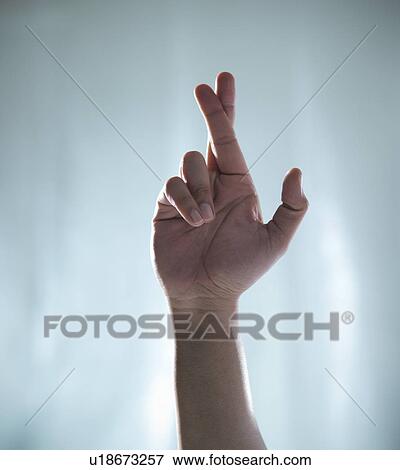 Close up of hand with crossed fingers View Large Photo Image Stock Photo - Close up of hand with crossed fingers. Fotosearch