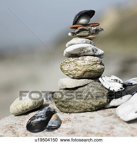 Close up of stack of rocks and shells View Large Photo Image Stock Image - Close up of stack of rocks and shells. Fotosearch