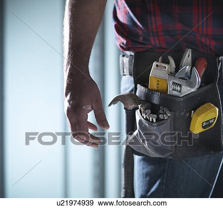 Close up of worker wearing tool belt View Large Photo Image Stock Photo - Close up of worker wearing tool belt. Fotosearch