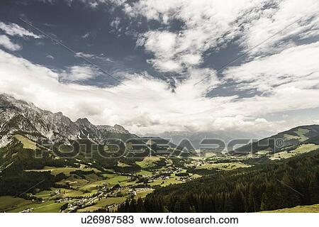 Clouds over grassy rural landscape View Large Photo Image Stock Image - Clouds over grassy rural landscape. Fotosearch