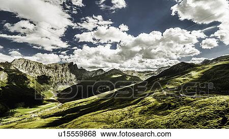 Clouds over grassy rural landscape View Large Photo Image Stock Photo - Clouds over grassy rural landscape. Fotosearch
