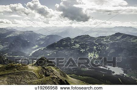 Clouds over grassy rural landscape View Large Photo Image Stock Photo - Clouds over grassy rural landscape. Fotosearch