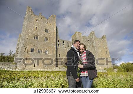 Couple hugging by medieval castle View Large Photo Image Stock Photo - Couple hugging by medieval castle. Fotosearch