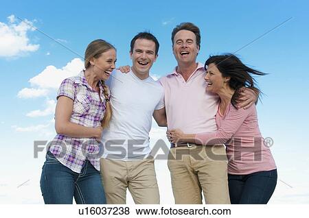 Couple smiling together outdoors View Large Photo Image Stock Photo - Couple smiling together outdoors. Fotosearch