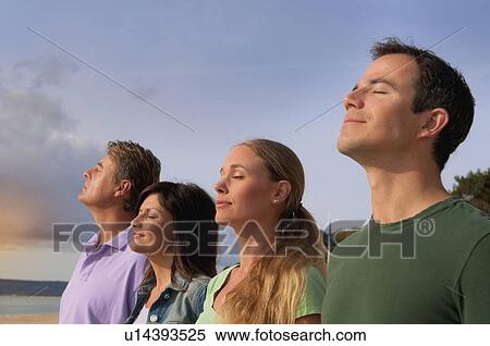 Couples relaxing together outdoors View Large Photo Image Stock Photography - Couples relaxing together outdoors. Fotosearch