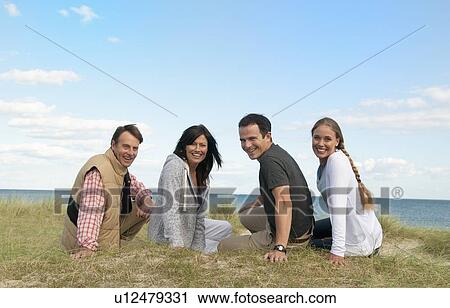Couples sitting together outdoors View Large Photo Image Stock Image - Couples sitting together outdoors. Fotosearch
