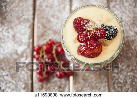 Stock Photo - Cup of custard with fruit. Fotosearch