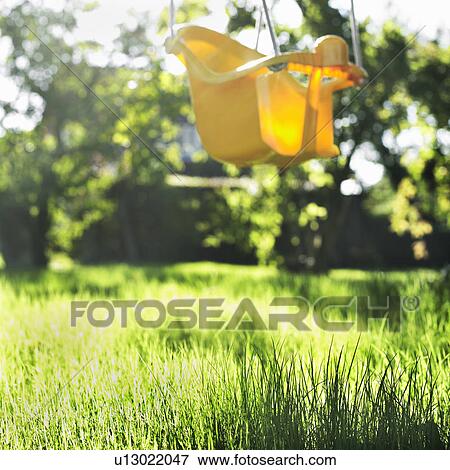 Empty chair swing in backyard View Large Photo Image Stock Photo - Empty chair swing in backyard. Fotosearch