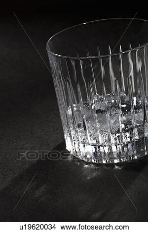 Empty glass of ice on table View Large Photo Image Picture - Empty glass of ice on table. Fotosearch