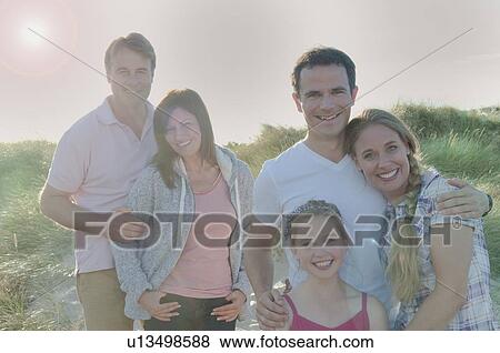 Families smiling together outdoors View Large Photo Image Stock Photo - Families smiling together outdoors. Fotosearch