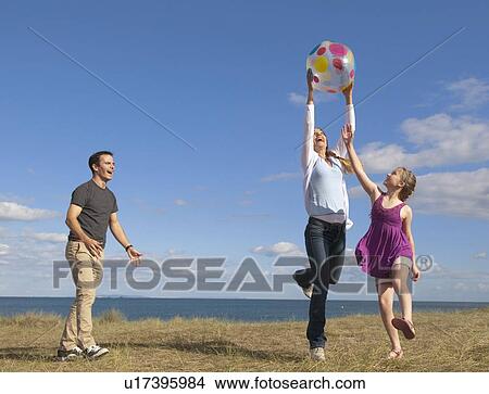 Family playing together outdoors View Large Photo Image Picture - Family playing together outdoors. Fotosearch