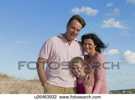 Family smiling together outdoors View Large Photo Image Stock Image - Family smiling together outdoors. Fotosearch