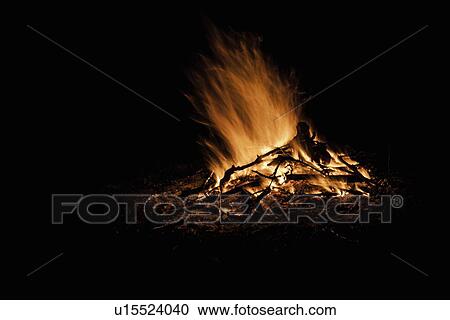 Fire burning outdoors at night View Large Photo Image Stock Image - Fire burning outdoors at night. Fotosearch