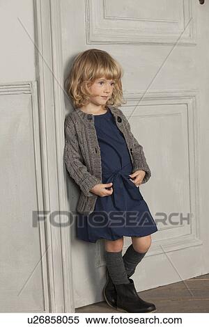 Girl leaning against door View Large Photo Image Stock Photography - Girl leaning against door. Fotosearch